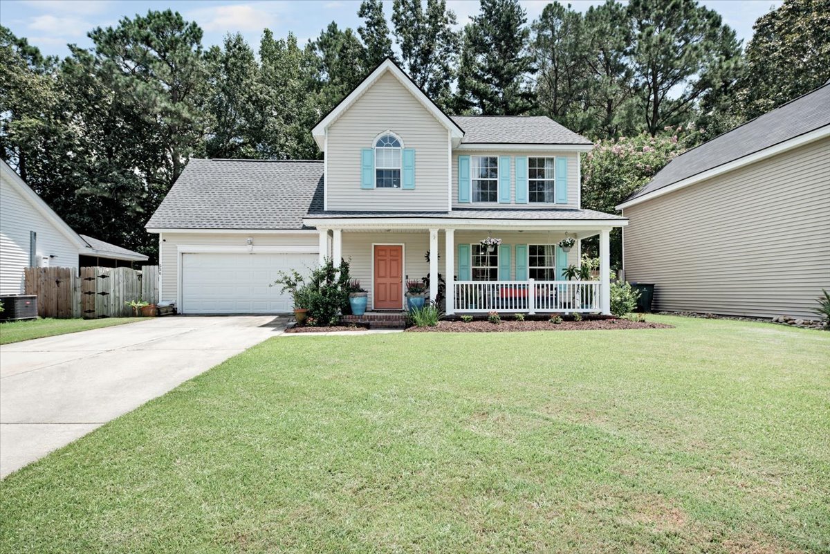 Two-story home with welcoming porch, an example of homes in Grand Oaks