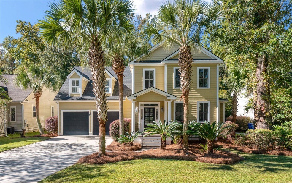 Hunt Club home framed by palm trees