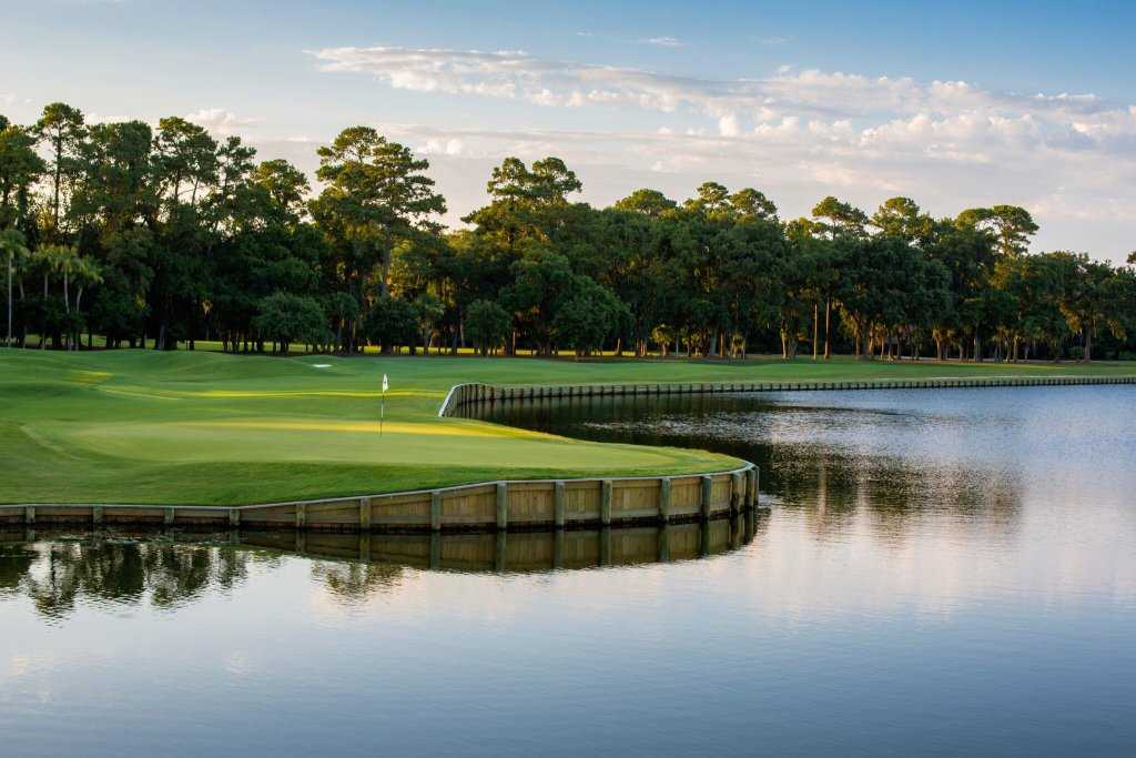 Golf course green beside a scenic lake in Shadowmoss